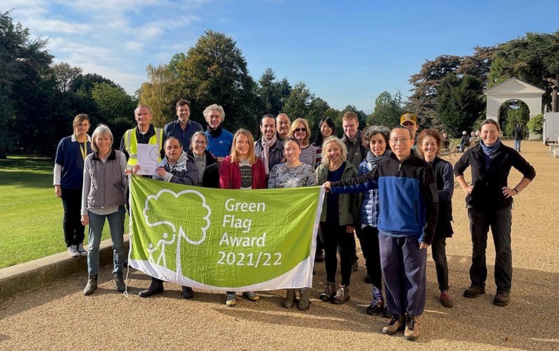 Gardeners and garden volunteering celebrating with the Green Flag 2021